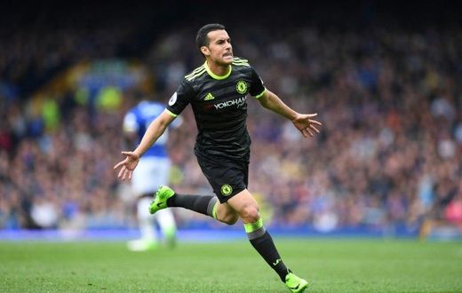 Chelsea's Spanish midfielder Pedro celebrates scores the opening goal during the English Premier League match against Everton at Goodison Park in Liverpool on April 30, 2017