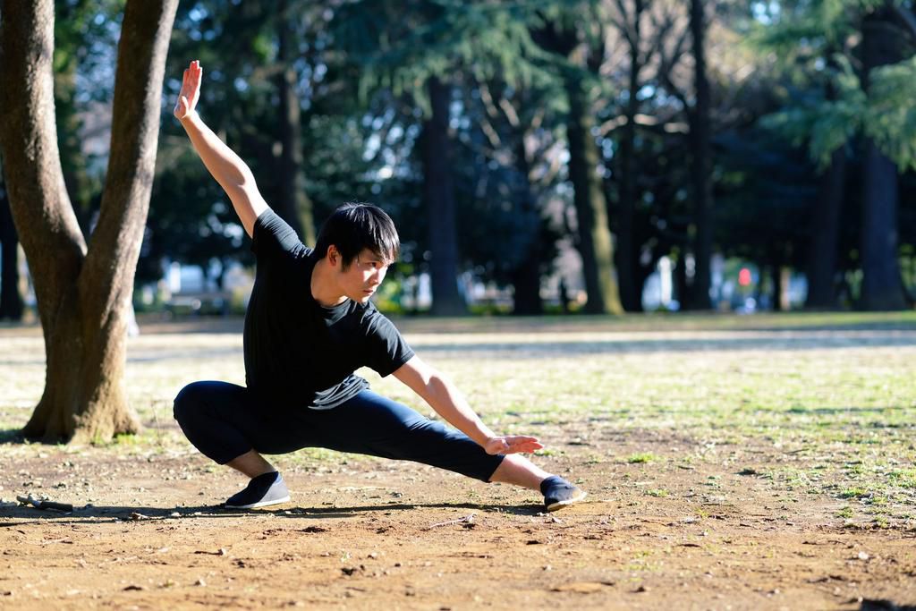 Young martial arts enthusiast practicing outside