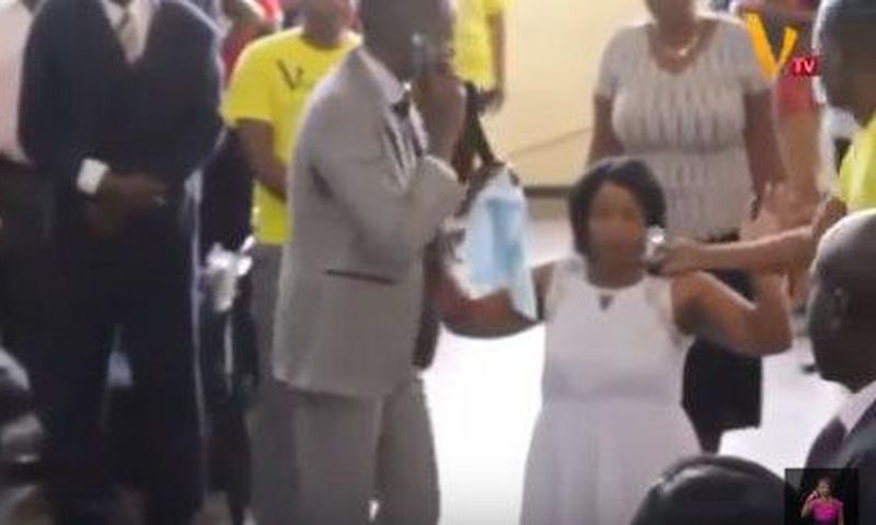 Pastor Paul Sanyangore on the phone with God