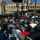 Muslim men attend the Friday prayers during a demonstration near Rome's ancient Colosseum