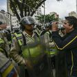 Venezuelan opposition deputy Rafael Guzman (C), confronts National Guard during a protest in front of the National Attorney's General office in Caracas