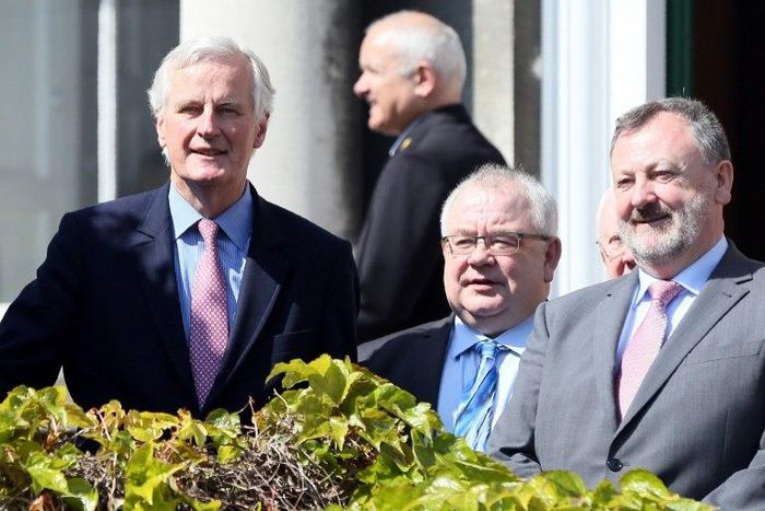 EU Brexit negotiator Michel Barnier (left) pledged in an address to Irish lawmakers to work with Dublic to avoid a 'hard border' with Northern Ireland when Britain leaves the EU