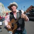 Kraig Moss sings his support for then Republican presidential candidate Donald Trump at a rally in March, 2016 in Janesville, Wisconsin