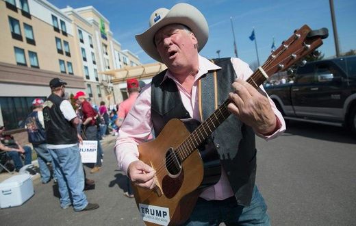 Kraig Moss sings his support for then Republican presidential candidate Donald Trump at a rally in March, 2016 in Janesville, Wisconsin