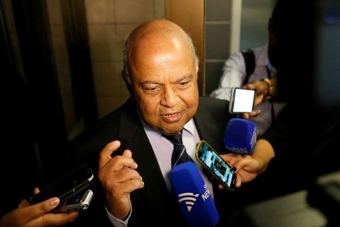 South African finance minister Pravin Gordhan speaks with journalists outside of the High Court on March 28, 2017 in Pretoria