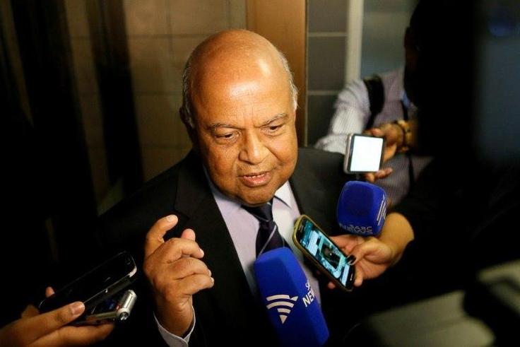 South African finance minister Pravin Gordhan speaks with journalists outside of the High Court on March 28, 2017 in Pretoria