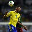 Gabon's forward Pierre-Emerick Aubameyang heads the ball with Cameroon's defender Ambroise Oyongo (back) during the 2017 Africa Cup of Nations group A football match between Cameroon and Gabon on January 22, 2017
