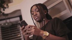 Black woman on the phone (Courtesy)