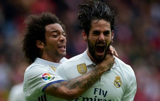 Real Madrid's Isco (R) is congratulated by Marcelo after scoring a goal during the Spanish league football match against Real Sporting de Gijon on April 15, 2017