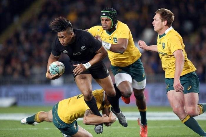 New Zealand's Julian Savea is tackled by Australia's Henry Speight (2nd R), Bernard Foley (R) and Israel Folau during the third Bledisloe Cup Test at Eden Park in Auckland on October 22, 2016