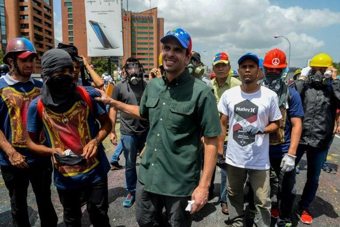 Opposition leader Henrique Capriles (C) takes part in a demonstration against President Nicolas Maduro in Caracas
