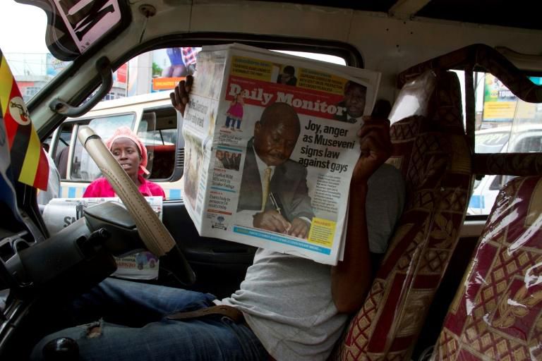 Ugandan citizen reading the Daily Monitor