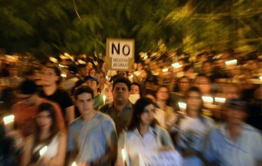 Thousands of demonstrators rally in front of the Congress in Asuncion on April 3, 2017 to protest against a bid to lift a ban on President Horacio Cartes that would allow him to be reelected