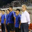 North Korea's coach Jørn Andersen (R) stands next to officials and players ahead of a friendly match in Ho Chi Minh City, in October 2016