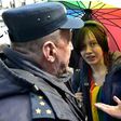 Russian riot police detain a gay rights activist at a May Day rally in Saint Petersburg