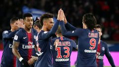 Edinson Cavani celebrates with his teammates after scoring one of his two goals in PSG's 4-1 win over Rennes on Sunday