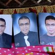 Portraits of Abdallah El-Hamahmy, the Egyptian suspected of attacking soldiers at Paris's Louvre museum, are placed on a sofa at the family home in the Nile delta city of Mansura, Egypt