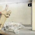 Image grab taken from a video released by the Media Office of the Nineveh branch of the Islamic State (IS) Group on February 26, 2015 allegedly showing an IS militant pushing a statue inside the Mosul museum