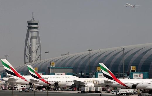 FILE PHOTO: Emirates Airlines aircrafts are seen at Dubai International Airport, United Arab Emirates May 10, 2016.