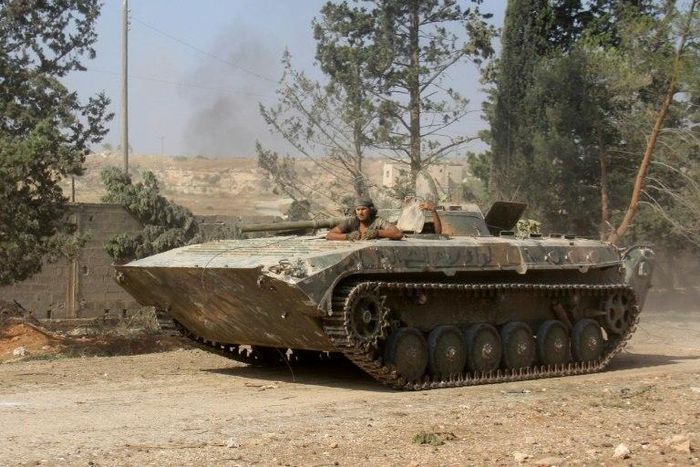 Fighters from Fateh al-Sham Front take positions south of Aleppo in August 2016 during an offensive to break the government siege of the city