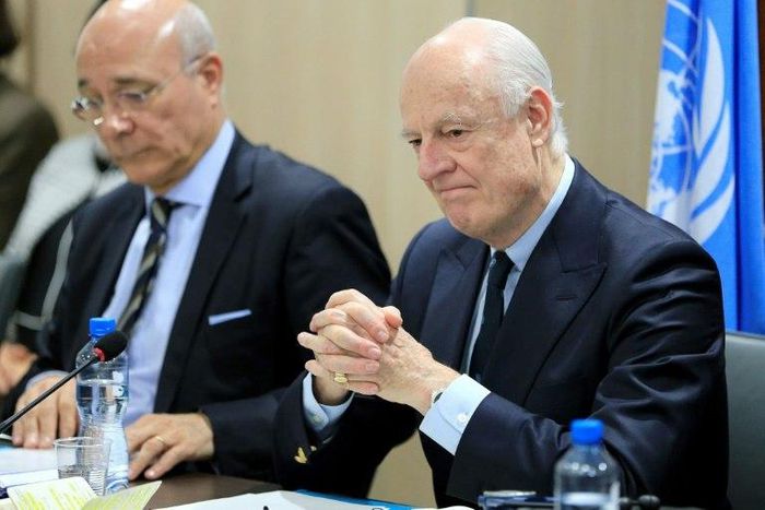UN Special Envoy for Syria Staffan de Mistura (R) attends a meeting of Intra-Syria peace talks with Syrian government delegation at the Palais des Nations in Geneva on February 25, 2017