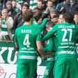Werder Bremen's players react after scoring the first goal during the German First division Bundesliga football match March 18, 2017