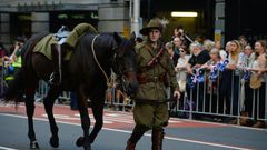 An Australian soldier walks with his horse in the Anzac Day parade in Sydney on April 25, 2017