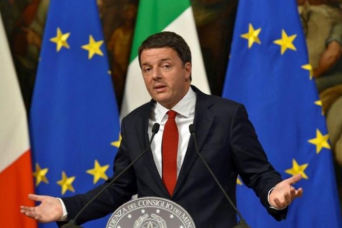 Italian Prime Minister Matteo Renzi gestures as he delivers a speech during a press conference at Palazzo Chigi in Rome ahead of a crucial referendum on constitutional reform