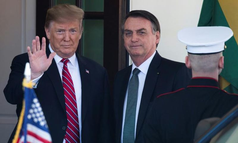 Brazilian President Jair Bolsonaro (L), pictured here with US President Donald Trump, has seen his image tarnished by a series of political scandals
