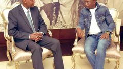 Ababu Namwamba trolled after dressing like “Awilo Longomba” for South Africa trip