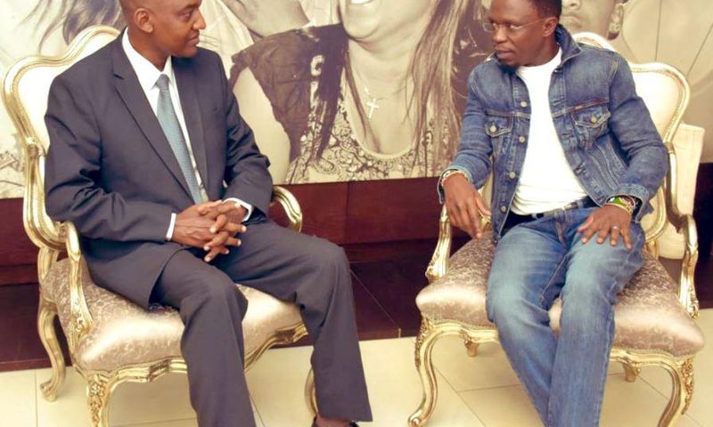 Ababu Namwamba trolled after dressing like “Awilo Longomba” for South Africa trip