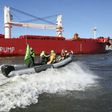 Activists of Greenpeace have painted 'No Coal No Trump' on the side of the 'SBI Subaru' ship with some 60,000 tons of coal from Texas on board in Hamburg, nothern Germany on June 1, 2017