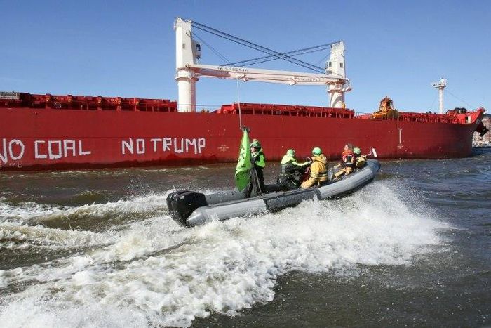 Activists of Greenpeace have painted 'No Coal No Trump' on the side of the 'SBI Subaru' ship with some 60,000 tons of coal from Texas on board in Hamburg, nothern Germany on June 1, 2017