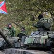 Pro-Russian separatists soldiers withdraw their tanks from position near town of Novoazovsk in Donetsk region on October 21, 2015