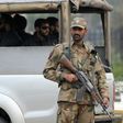 A Pakistani army soldier stands guard at a checkpoint in the garrison city of Rawalpindi on December 5, 2009