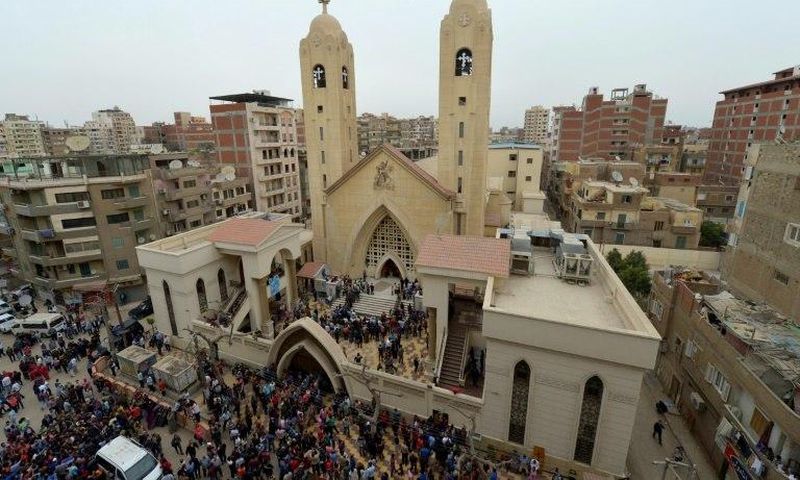 A general view shows people gathering outside the Mar Girgis Coptic Church in the Nile Delta City of Tanta, 120 kilometres (75 miles) north of Cairo, after a bomb blast struck worshippers gathering to celebrate Palm Sunday on April 9, 2017