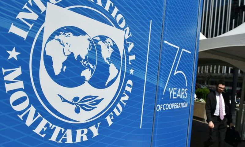 The seal of the International Monetary Fund (IMF) is seen outside of the headquarters building in Washington, DC on April 8, 2019.