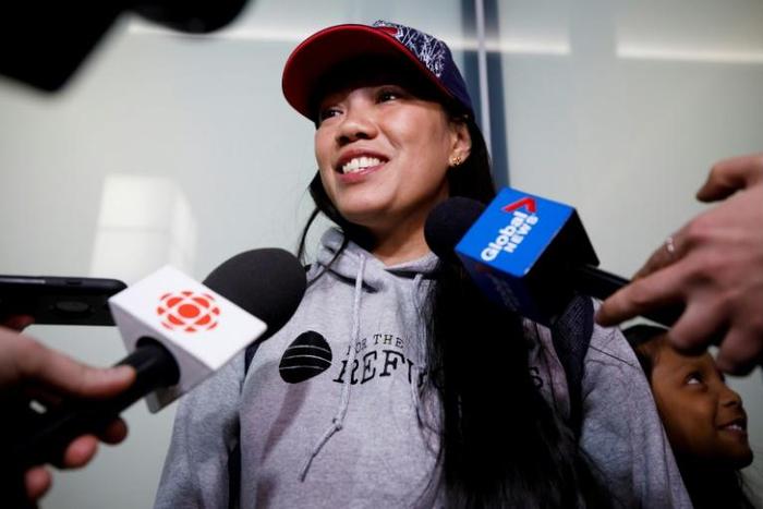 Vanessa Rodel smiles during a media scrum after arriving with her daughter Keana to the Toronto airport on a flight from Hong Kong, in Toronto, Canada, March 25, 2019