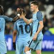 Manchester City's John Stones (R) celebrates with teammate Bacary Sagna after scoring a goal during their English FA Cup 3rd round match against West Ham United, at the London Stadium, on January 6, 2017