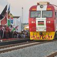 Kenyan President Uhuru Kenyatta flags off a cargo train at the port city of Mombasa on May 30, 2017, as it leaves the container terminal on its inaugural journey to Nairobi