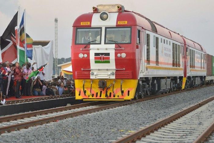 Kenyan President Uhuru Kenyatta flags off a cargo train at the port city of Mombasa on May 30, 2017, as it leaves the container terminal on its inaugural journey to Nairobi