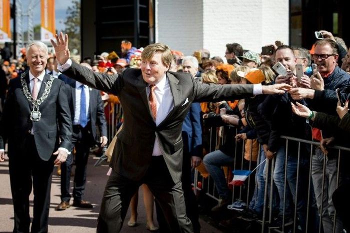 Dutch King Willem-Alexander gestures as he celebrates his 50th birthday on the traditional King's Day (Koningsdag) in the southern city of Tilburg