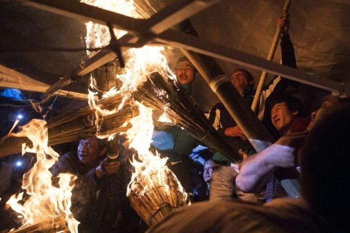 Participants prepare for the release of a hot-air balloon during the Tazaungdaing Lighting Festival at Taunggyi in Myanmar's northeastern Shan State