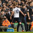 Tottenham Hotspur's Harry Kane (L) is greeted by team manager Mauricio Pochettino as he leaves the pitch substituted during their English Premier League match against Stoke City, at White Hart Lane in London, on February 26, 2017