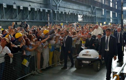 Pope Francis received a rapturous reception from workers at a steel plant in Genoa, where he warned against the dangers of financial speculation and a "faceless" economy which discards workers' interests