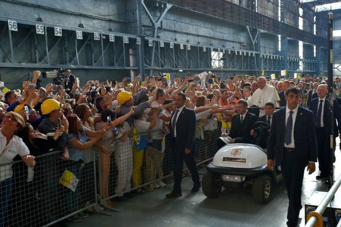 Pope Francis received a rapturous reception from workers at a steel plant in Genoa, where he warned against the dangers of financial speculation and a "faceless" economy which discards workers' interests
