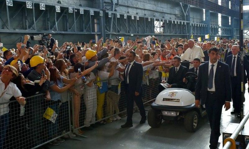 Pope Francis received a rapturous reception from workers at a steel plant in Genoa, where he warned against the dangers of financial speculation and a "faceless" economy which discards workers' interests