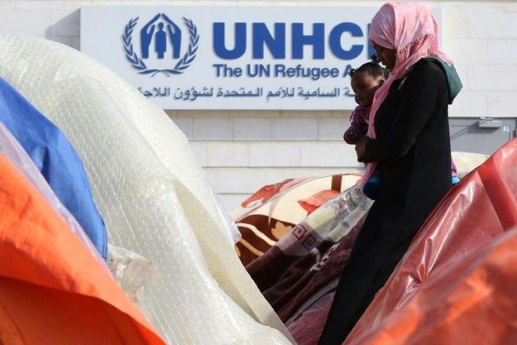 Armed men have abducted three UN refugee agency staffers, from Sudan's strife-torn Darfur region, an official says