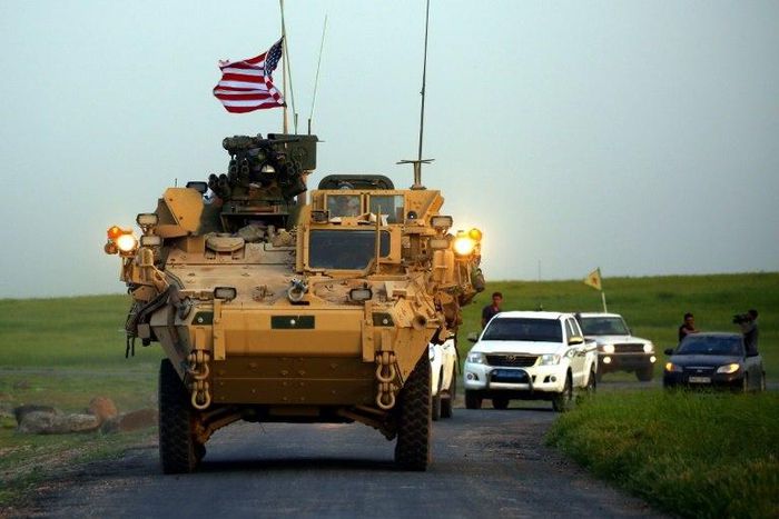 US forces accompanied by Kurdish People's Protection Units fighters patrol the Syria-Turkey border late last month