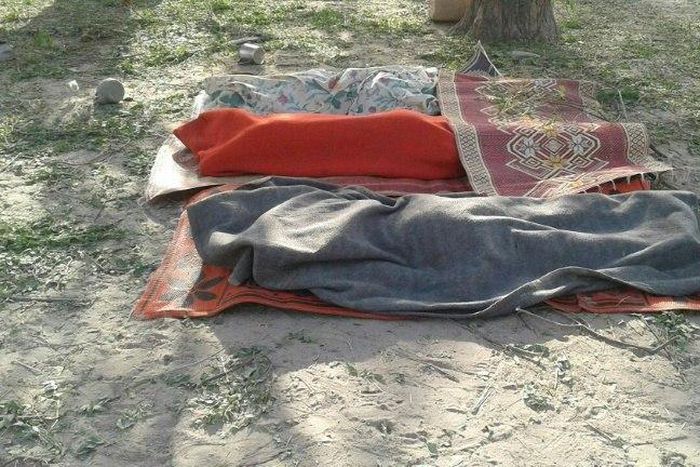 Bodies covered with blankets are pictured in Rann, northeast Nigeria on January 17, 2017 after an an air force jet accidentally bombarded a camp for displaced people